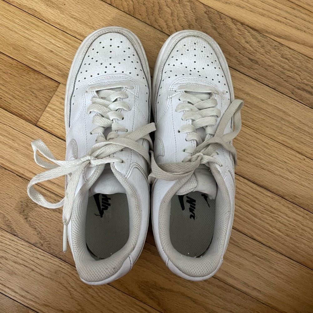 all white nike court sneakers